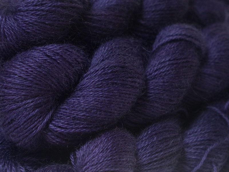 Semi-solid dark purple, with red-violet and royal purple tones hand-dyed Wensleydale DK/ Double Knit yarn. Hand-dyed by Triskelion Yarn