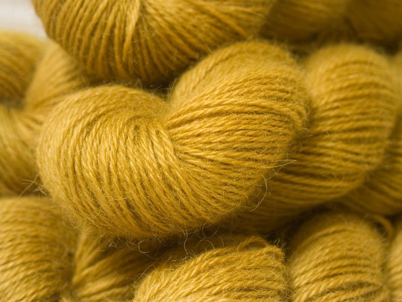 Semi-solid yellow, with tones of ochre and antique gold hand-dyed Wensleydale DK/ Double Knit yarn. Hand-dyed by Triskelion Yarn