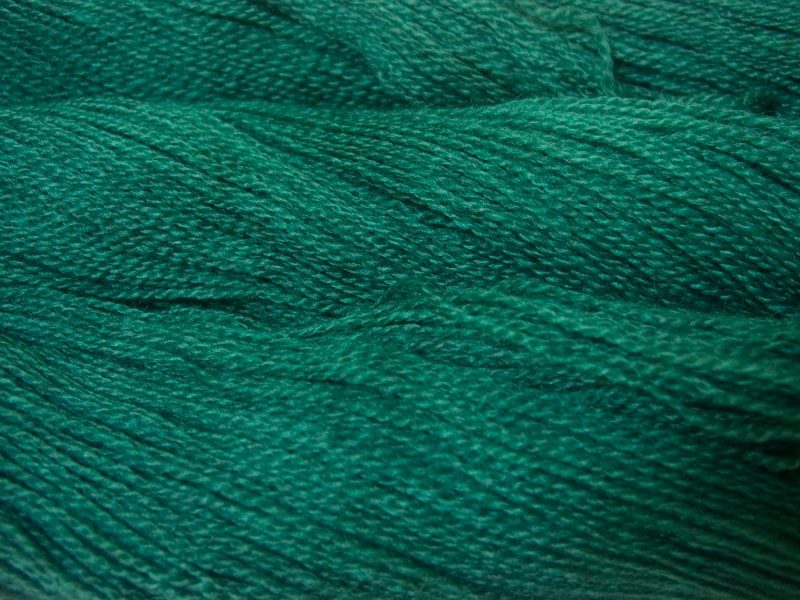 Semi-solid mid-tone teal green Bluefaced Leicester (BFL) / Gotland 4-ply (fingering) yarn. Hand-dyed by Triskelion Yarn