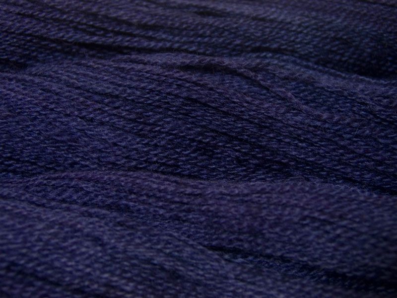 Semi-solid midnight blue, with violet and cobalt tones Bluefaced Leicester (BFL) / Gotland 4-ply (fingering) yarn. Hand-dyed by Triskelion Yarn