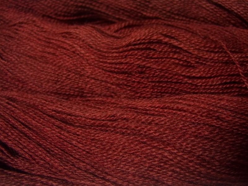 Semi-solid rich brown, with copper and russet tones Bluefaced Leicester (BFL) / Gotland 4-ply (fingering) yarn. Hand-dyed by Triskelion Yarn