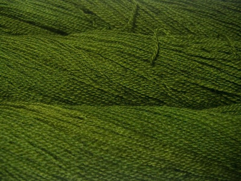 Semi-solid foliage green, with ochre and olive tones Bluefaced Leicester (BFL) / Gotland 4-ply (fingering) yarn. Hand-dyed by Triskelion Yarn