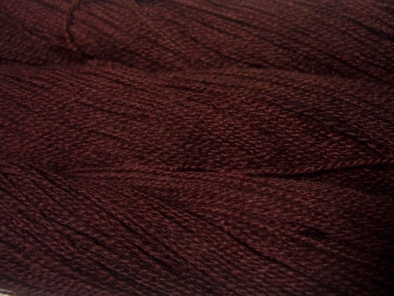 Semi-solid rich truffle brown Bluefaced Leicester (BFL) / Gotland 4-ply (fingering) yarn. Hand-dyed by Triskelion Yarn