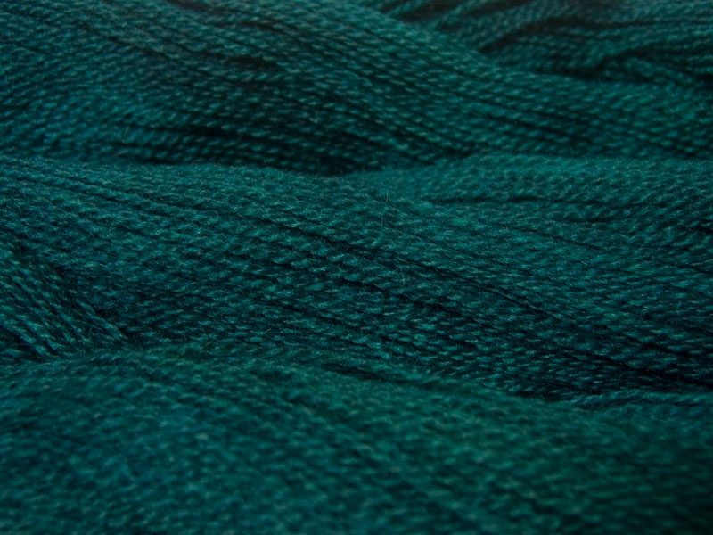 Semi-solid dark sea blue, with petrol blue, teal and sea green tones Bluefaced Leicester (BFL) / Gotland 4-ply (fingering) yarn. Hand-dyed by Triskelion Yarn
