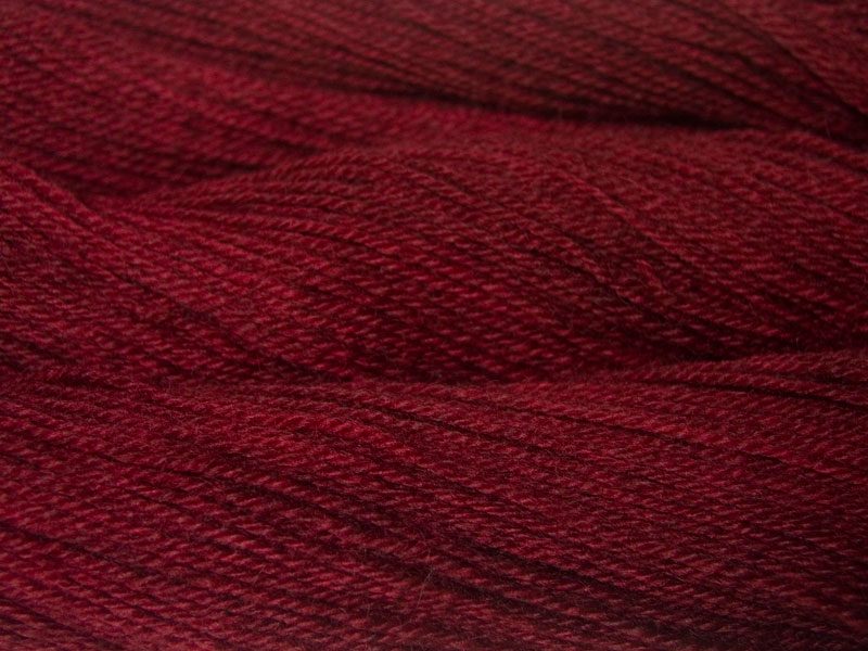 Norn - Semi-solid dark red, with tones of cherry and carmine Bluefaced Leicester (BFL) / Gotland dlouble knit (DK) yarn. Hand-dyed by Triskelion Yarn