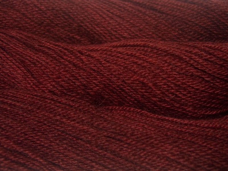 Old Red - a deep desaturated brick red Bluefaced Leicester (BFL) / Gotland dlouble knit (DK) yarn. Hand-dyed by Triskelion Yarn
