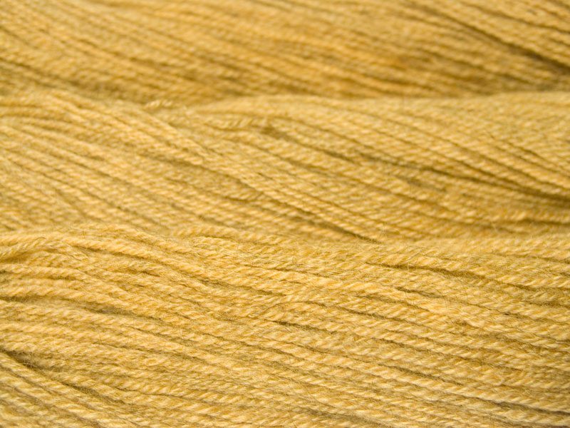 Otter's Cairn - Semi-solid yellow, with tones of ochre and antique gold Bluefaced Leicester (BFL) / Gotland dlouble knit (DK) yarn. Hand-dyed by Triskelion Yarn