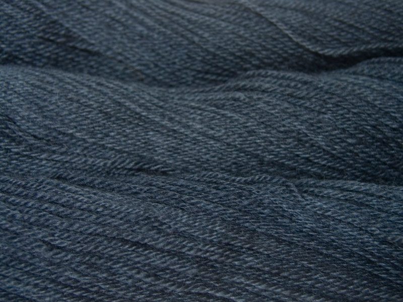 Thunor's Brow - Semi-solid mid- to dark grey, with tones of stormy blue and violet Bluefaced Leicester (BFL) / Gotland dlouble knit (DK) yarn. Hand-dyed by Triskelion Yarn