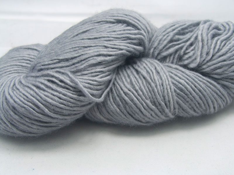 Light to mid neutral grey Bluefaced Leicester double knit (DK) singles yarn hand-dyed by Triskelion Yarns