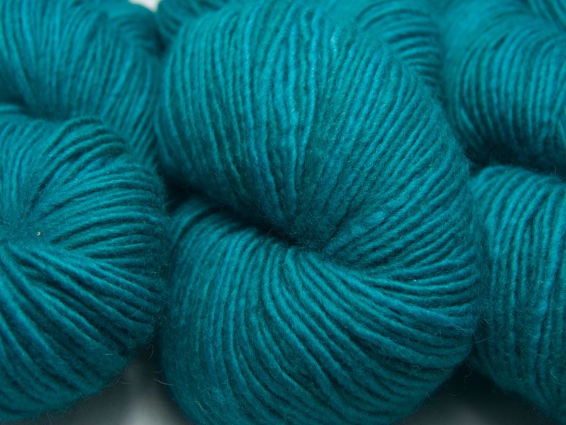 Mid-tone turquoise Bluefaced Leicester double knit (DK) singles yarn hand-dyed by Triskelion Yarns