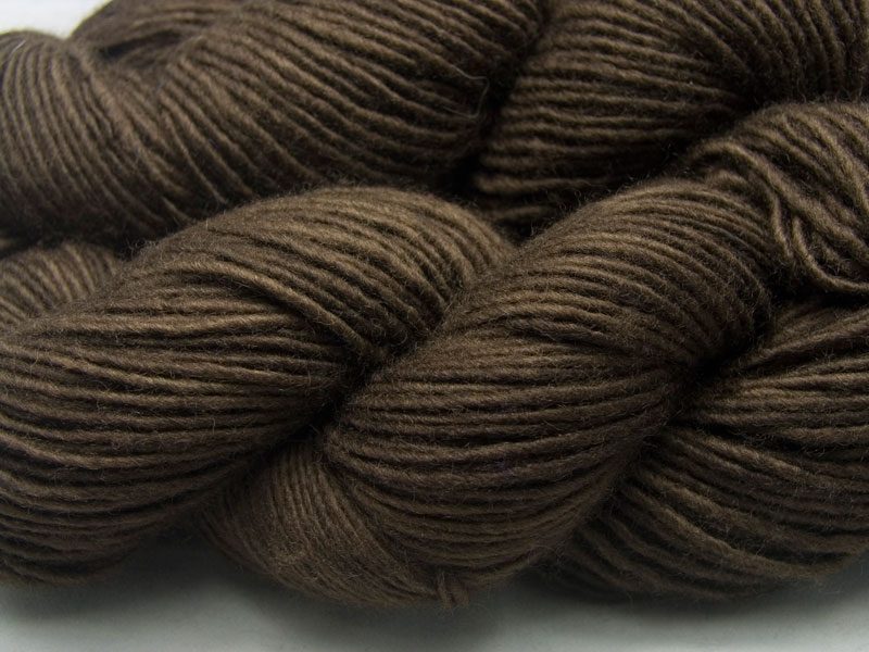 Semi-solid to solid rich dark brown Bluefaced Leicester double knit (DK) singles yarn hand-dyed by Triskelion Yarns