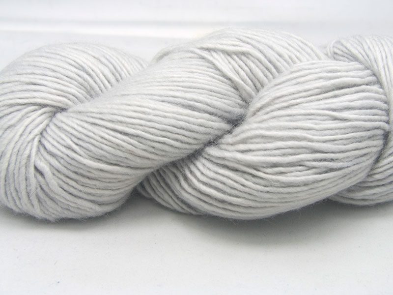 Pale silver grey Bluefaced Leicester double knit (DK) singles yarn hand-dyed by Triskelion Yarns