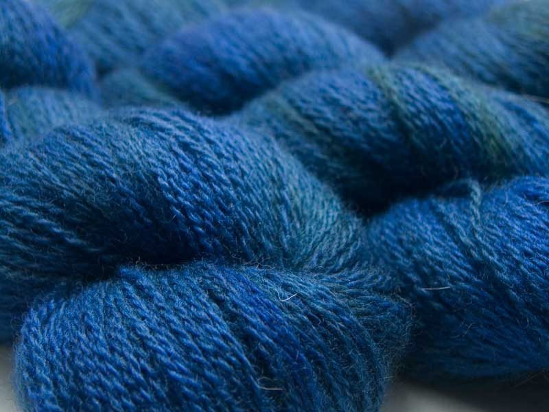 Mid to dark teal green with blue variations Bluefaced Leicester (BFL) / Masham aran yarn. Hand-dyed by Triskelion Yarn