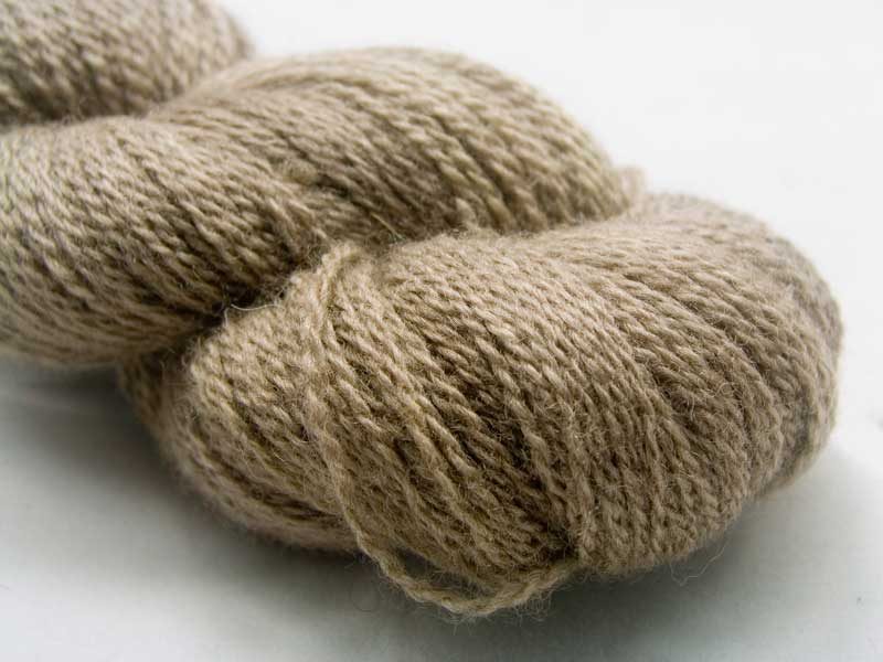 Woodcut - Semi-solid to solid cool light brown Bluefaced Leicester (BFL) / Masham aran yarn. Hand-dyed by Triskelion Yarn