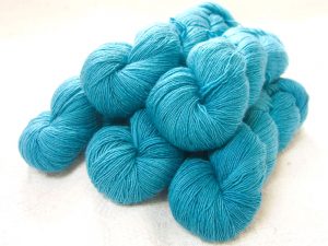 Captain Cat - Semi-solid dark turquoise Falklands Merino and silk blend yarn. Hand-dyed by Triskelion Yarn.