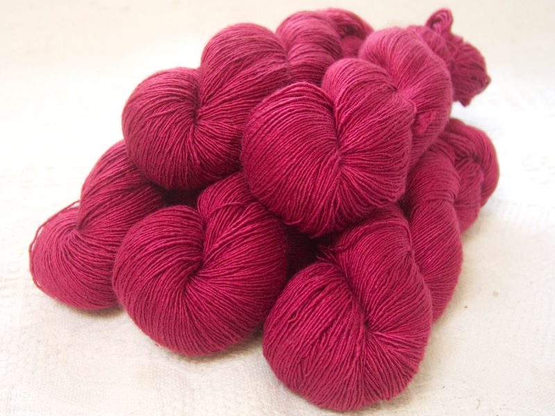 Idisi - Semi-solid deep rose Falklands Merino and silk blend yarn. Hand-dyed by Triskelion Yarn.