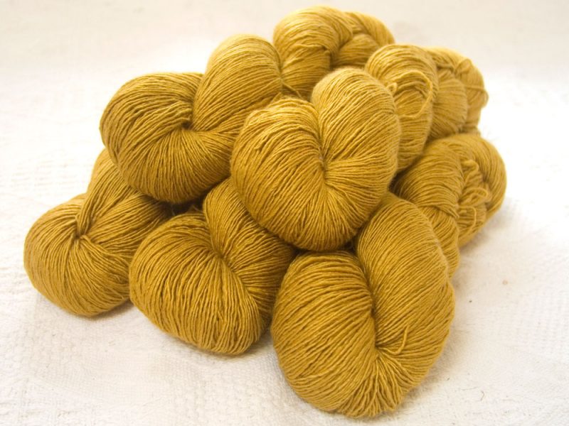 Ochre - Deep ochre yellow Falklands Merino and silk blend yarn. Hand-dyed by Triskelion Yarn.