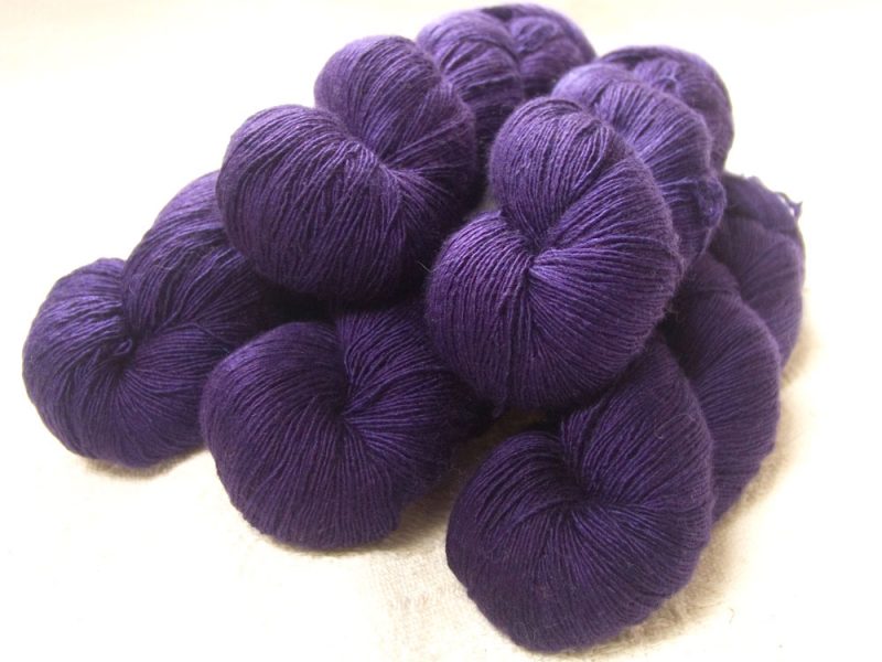 Old Mogul - Semi-solid dark purple, with red-violet and royal purple tones Falklands Merino and silk blend yarn. Hand-dyed by Triskelion Yarn.