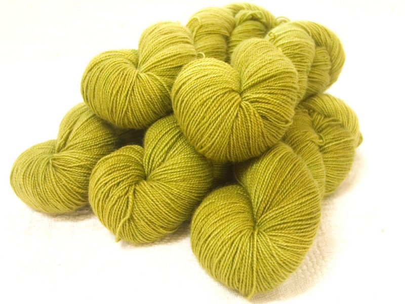 Semi-solid chartreuse green, with ochre and spring green tones superwash Bluefaced Leicester (BFL) 4-ply/fingering/sock yarn. Hand-dyed by Triskelion Yarn