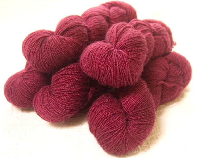 Semi-solid dark rose, with tones of pink and carmine superwash Bluefaced Leicester (BFL) 4-ply/fingering/sock yarn. Hand-dyed by Triskelion Yarn