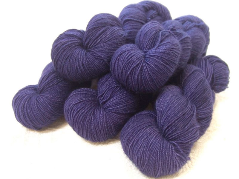 Semi-solid dark purple, with red-violet and royal purple tones superwash Bluefaced Leicester (BFL) 4-ply/fingering/sock yarn. Hand-dyed by Triskelion Yarn