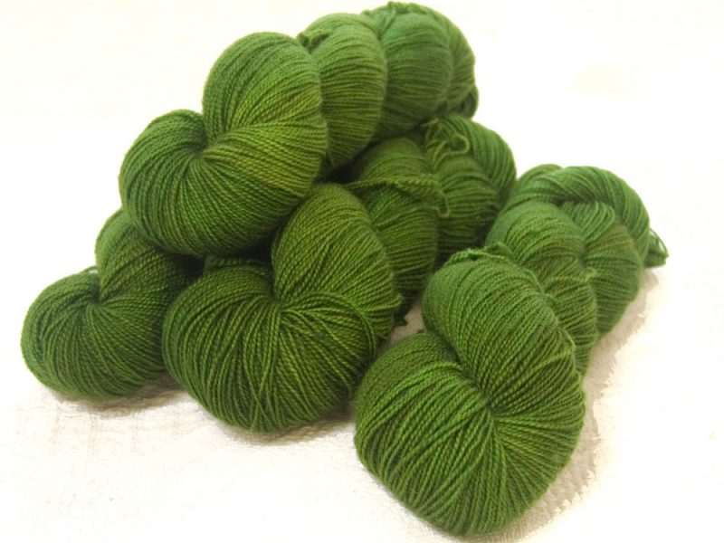 Semi-solid foliage green, with ochre and olive tones superwash Bluefaced Leicester (BFL) 4-ply/fingering/sock yarn. Hand-dyed by Triskelion Yarn