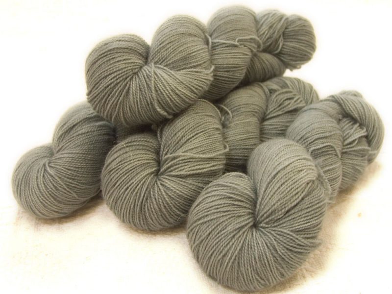 Semi-solid light to mid surf grey, with sea green and turquoise tones superwash Bluefaced Leicester (BFL) 4-ply/fingering/sock yarn. Hand-dyed by Triskelion Yarn