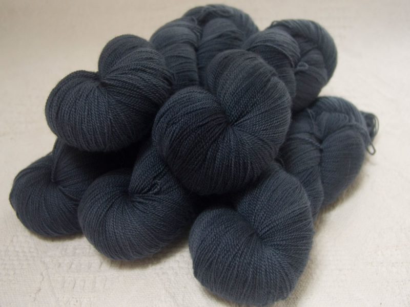 “Lives of the Great Poisoners” - Semi-solid mid to dark grey, with tones of stormy blue and violet extra fine Falklands Merino 2-ply laceweight yarn hand-dyed by Triskelion Yarns