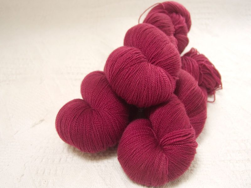 Mrs Dai Bread Two - Semi-solid dark rose, with tones of pink and carmine extra fine Falklands Merino 2-ply laceweight yarn hand-dyed by Triskelion Yarns