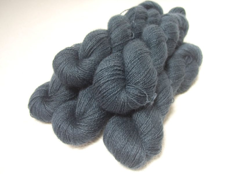 “Lives of the Great Poisoners” - Semi-solid mid to dark grey, with tones of stormy blue and violet hand-dyed Wensleydale DK/ Double Knit yarn. Hand-dyed by Triskelion Yarn