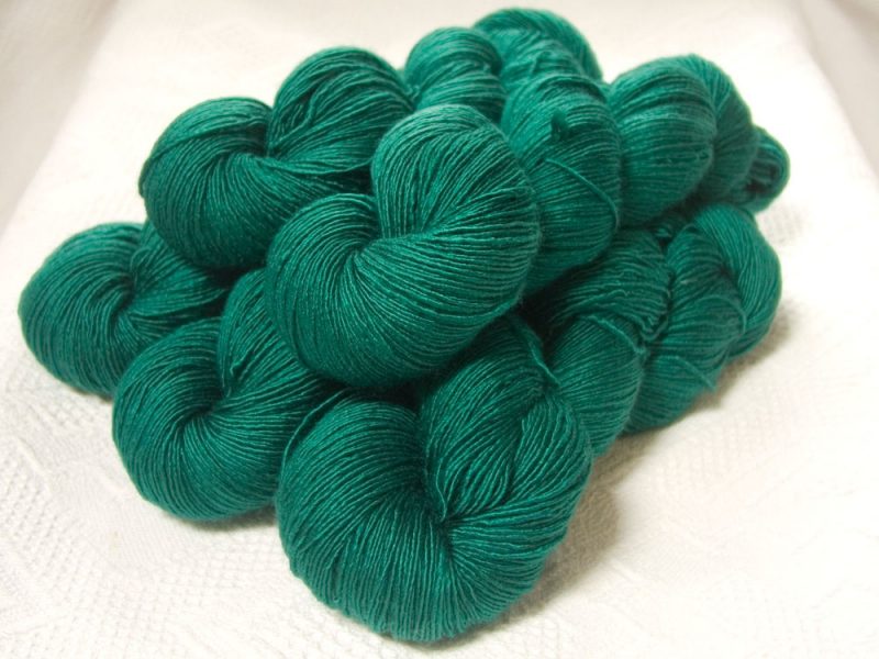 Nicor - Semi-solid mid-tone blue-green Falklands Merino and silk blend yarn. Hand-dyed by Triskelion Yarn.