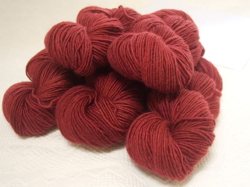 Berry - Mid-tone red Bluefaced Leicester (BFL) / Masham worsted yarn. Hand-dyed by Triskelion Yarn