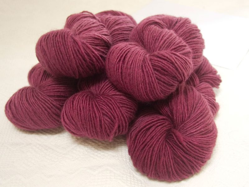 Cassiopeia - Rich mid-tone rose Bluefaced Leicester (BFL) / Masham worsted yarn. Hand-dyed by Triskelion Yarn