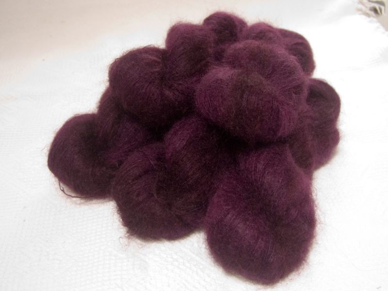 Damson - Mid-tone violet red kidsilk laceweight yarn. Hand-dyed by Triskelion Yarn