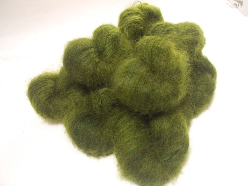 Rum and Laverbread - Semi-solid foliage green, with ochre and olive tones kidsilk laceweight yarn. Hand-dyed by Triskelion Yarn