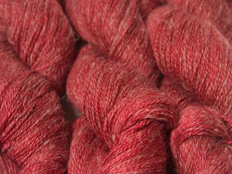 Semi-solid deep red Baby Alpaca, silk and linen heavy laceweight yarn. Hand-dyed by Triskelion Yarn.