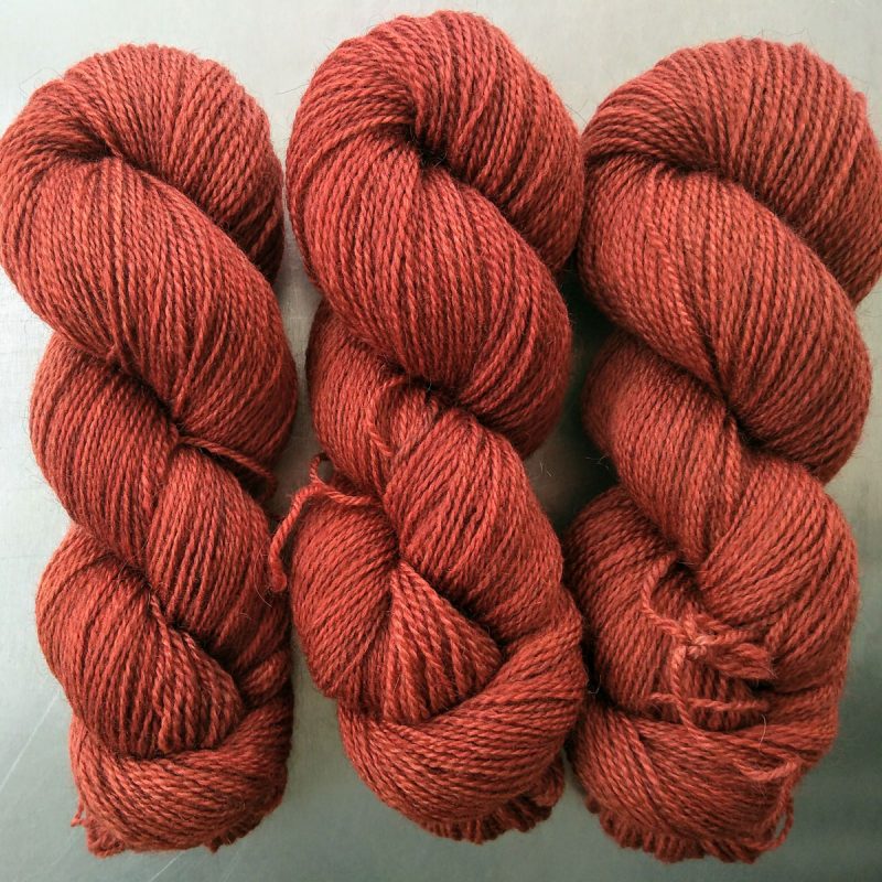 Cofgodas - Semi-solid dark orange, with tones of copper, vermillion and russet Bluefaced Leicester (BFL) / Gotland 4-ply (fingering) yarn. Hand-dyed by Triskelion Yarn
