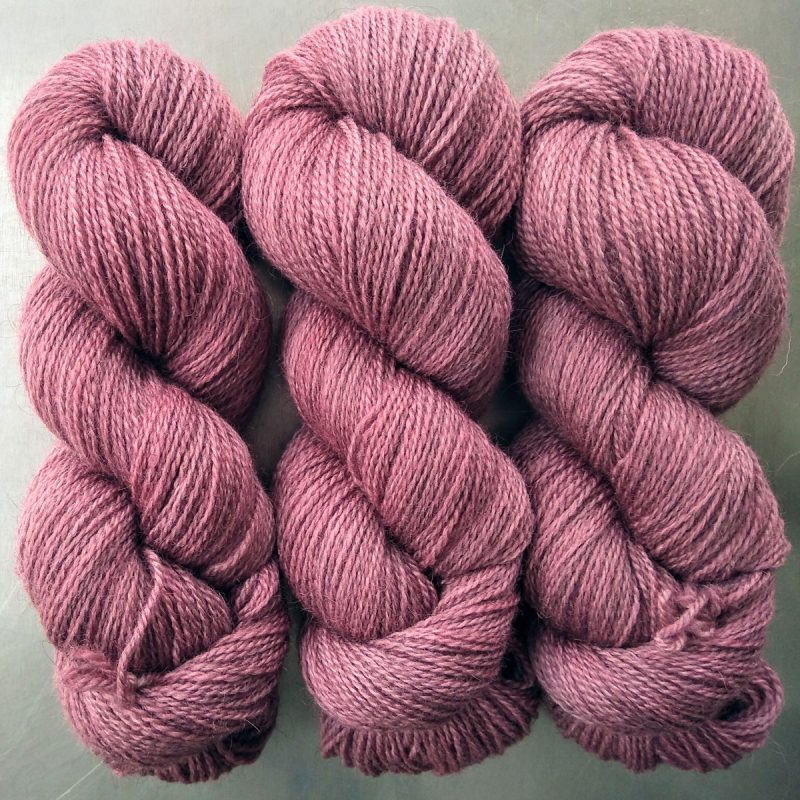 Eostre - Semi-solid dawn pink, with tones of scarlet and rose Bluefaced Leicester (BFL) / Gotland 4-ply (fingering) yarn. Hand-dyed by Triskelion Yarn