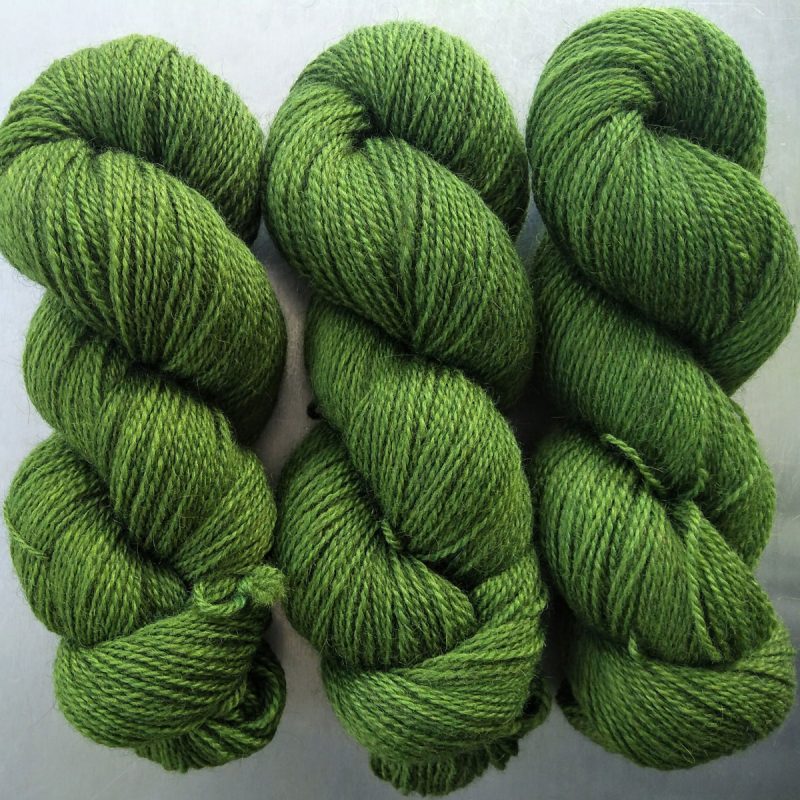Semi-solid foliage green, with ochre and olive tones Bluefaced Leicester (BFL) / Gotland 4-ply (fingering) yarn. Hand-dyed by Triskelion Yarn