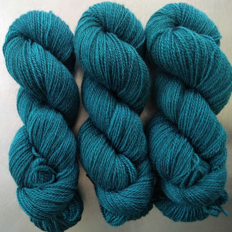Semi-solid dark sea blue, with petrol blue, teal and sea green tones Bluefaced Leicester (BFL) / Gotland 4-ply (fingering) yarn. Hand-dyed by Triskelion Yarn