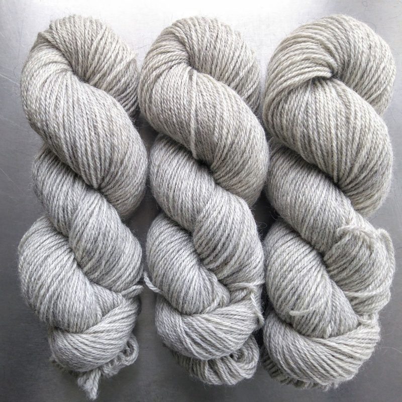 Ember's End - Semi-solid pale grey, with bright ash and silver tones Bluefaced Leicester (BFL) / Gotland dlouble knit (DK) yarn. Hand-dyed by Triskelion Yarn