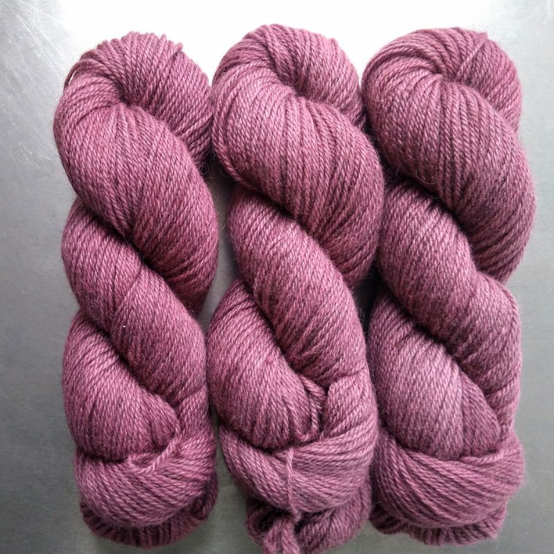 Eostre - Semi-solid dawn pink, with tones of scarlet and rose Bluefaced Leicester (BFL) / Gotland dlouble knit (DK) yarn. Hand-dyed by Triskelion Yarn
