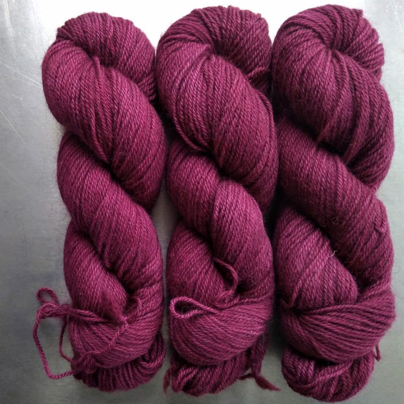 Modraniht - Semi-solid dark rose, with tones of pink and carmine Bluefaced Leicester (BFL) / Gotland dlouble knit (DK) yarn. Hand-dyed by Triskelion Yarn