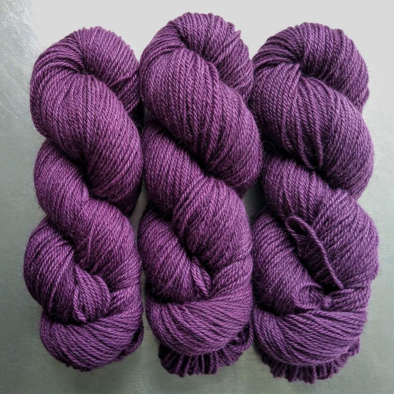 Ring Giver - Semi-solid dark purple, with red-violet and royal purple tones Bluefaced Leicester (BFL) / Gotland dlouble knit (DK) yarn. Hand-dyed by Triskelion Yarn