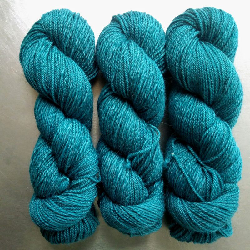 Tarn - Semi-solid turquoise, with sea blue and grey tones Bluefaced Leicester (BFL) / Gotland dlouble knit (DK) yarn. Hand-dyed by Triskelion Yarn