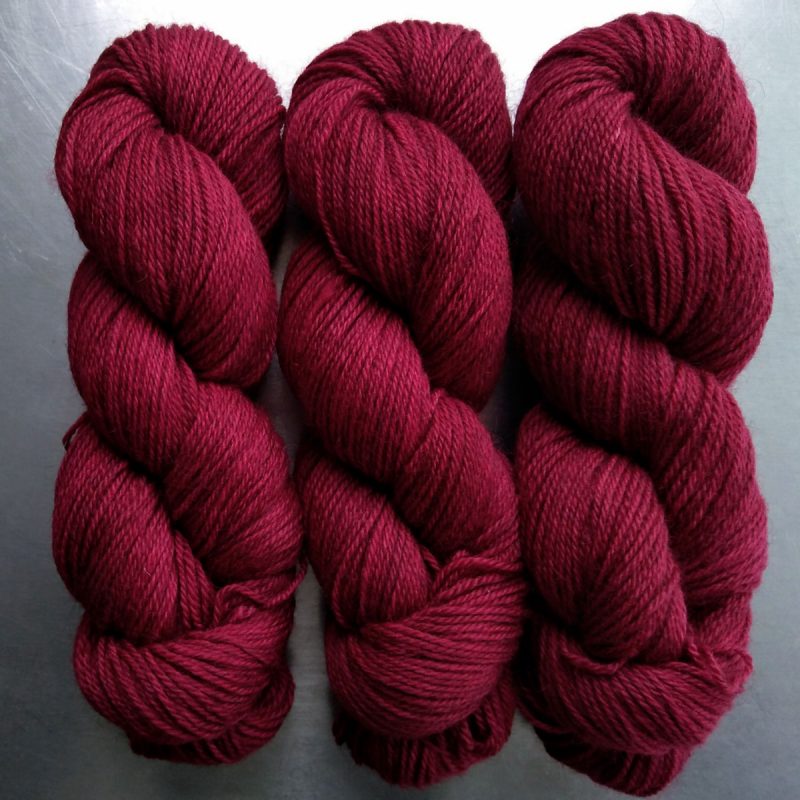 Wyrd - Deep red Bluefaced Leicester (BFL) / Gotland dlouble knit (DK) yarn. Hand-dyed by Triskelion Yarn