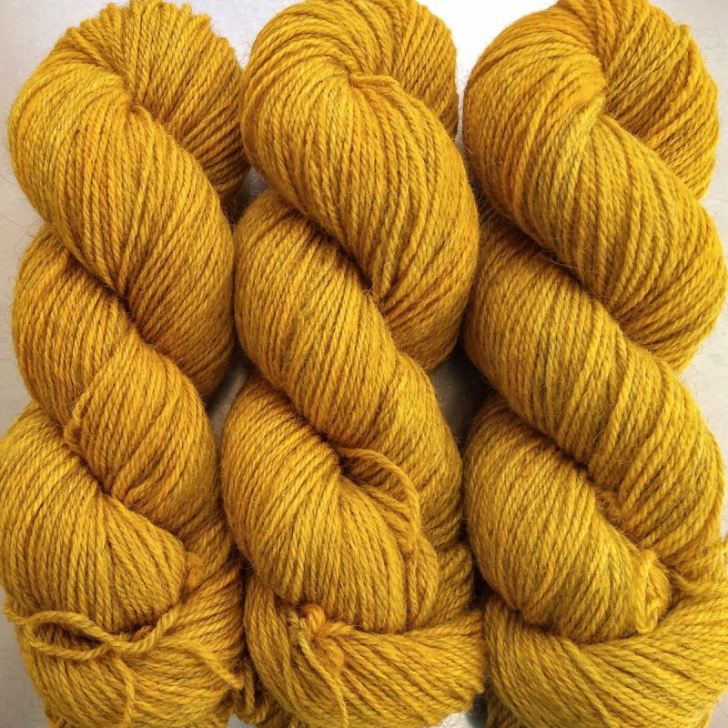 Heaven’s Gem - Rich imperial yellow Bluefaced Leicester (BFL) / Gotland dlouble knit (DK) yarn. Hand-dyed by Triskelion Yarn