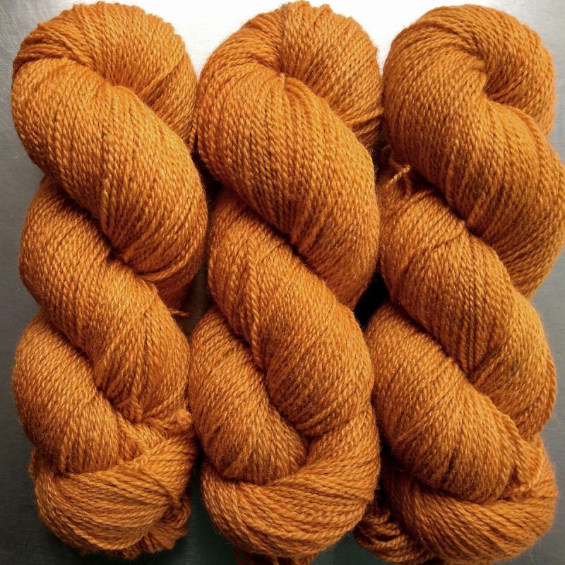 Bonfire - mid-tone fiery orange Bluefaced Leicester / silk 4-ply yarn. Hand-dyed by Triskelion Yarn.