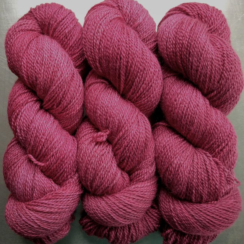 Rose - vibrant deep rose Bluefaced Leicester / silk 4-ply yarn. Hand-dyed by Triskelion Yarn.