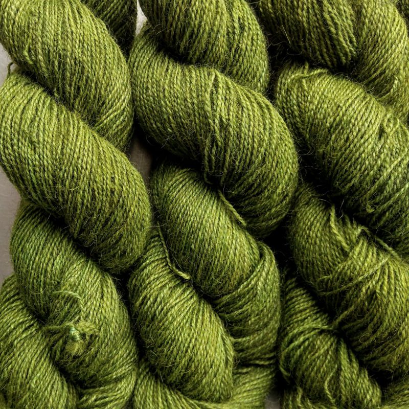 Gerda - Mid tone grassy green Bluefaced Leicester (BFL) / Gotland / Wensleydale 4-ply (fingering) weight high-twist sock yarn. Hand-dyed by Triskelion Yarn